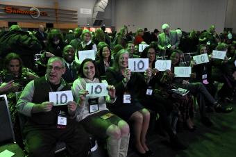 Members of the CEC Board of Directors holding up "10" signs after the CEC 2020 Convention & Expo opening keynote