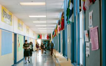 students in empty hallway